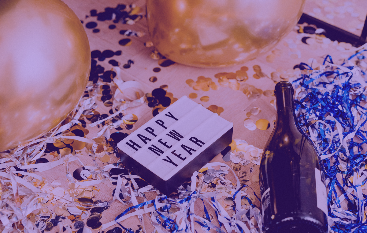 A party scene with party accessories and a sign saying Happy New Year