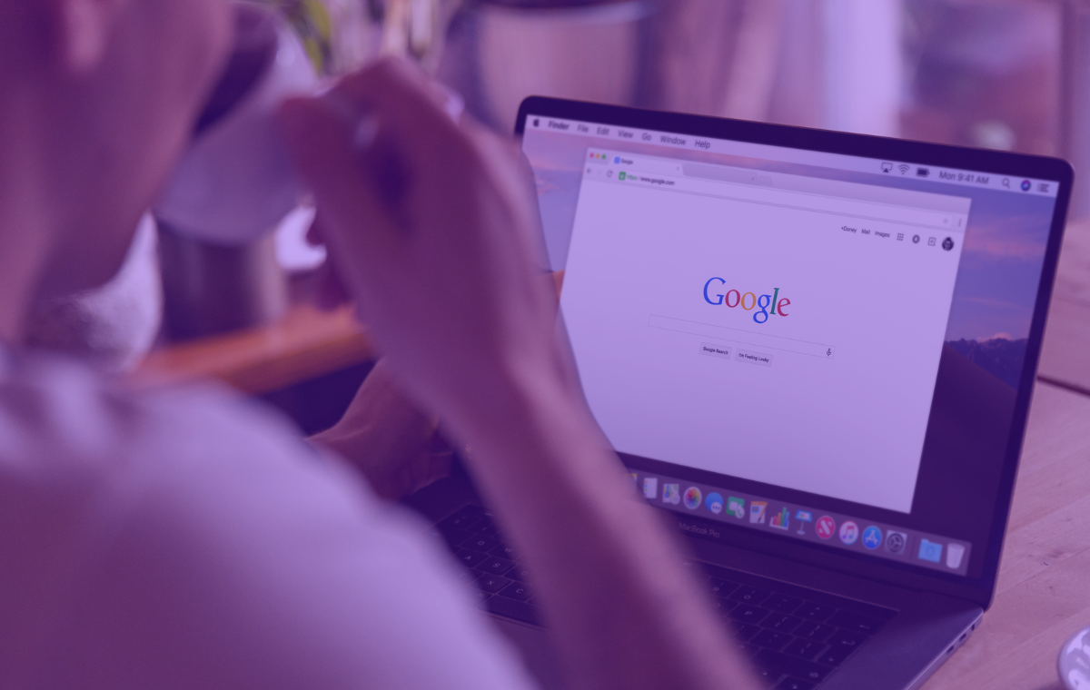 A person using Google on a laptop