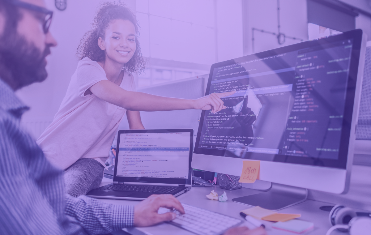 Two devs analyzing real user monitoring analytics on computers